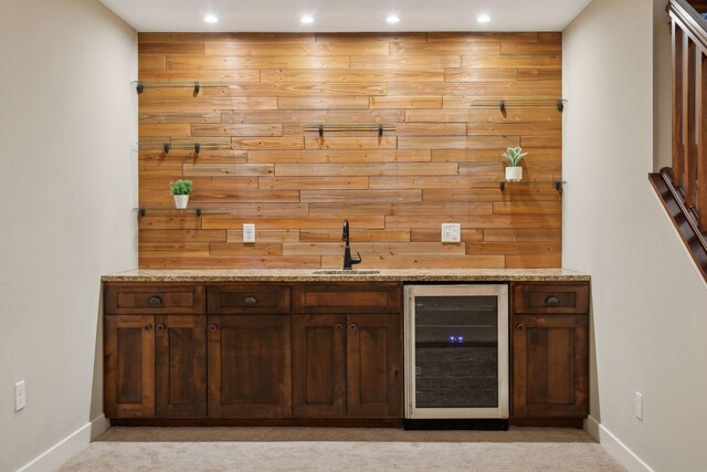 15653 Cobblestone Lake Pkwy, Apple Valley, MN 55124 - indoor wet bar with beverage cooler, recessed lighting, baseboards, light colored carpet, and wood walls