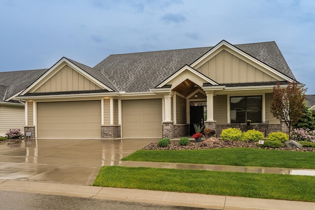 2720 Bentley Dr SW, Rochester, MN 55902 - craftsman inspired home featuring board and batten siding, covered porch, a garage, and a shingled roof