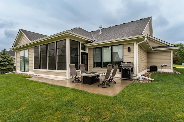 2720 Bentley Dr SW, Rochester, MN 55902 - rear view of house featuring a patio area, a lawn, an outdoor fire pit, and roof with shingles