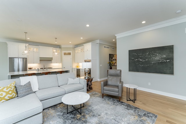 2720 Bentley Dr SW, Rochester, MN 55902 - living room with crown molding, recessed lighting, light wood-type flooring, and baseboards
