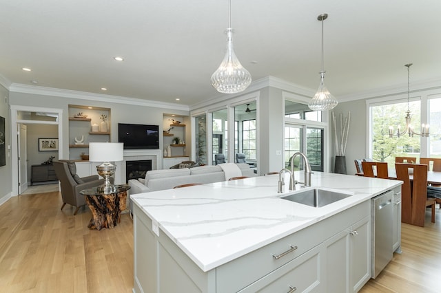 2720 Bentley Dr SW, Rochester, MN 55902 - kitchen with a sink, dishwasher, light wood-type flooring, ornamental molding, and a chandelier