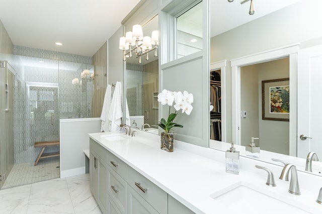 2720 Bentley Dr SW, Rochester, MN 55902 - full bathroom featuring a shower stall, double vanity, a chandelier, a spacious closet, and marble look tiles