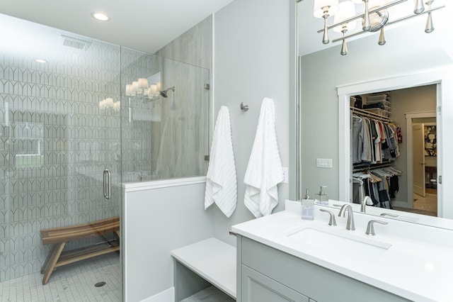 2720 Bentley Dr SW, Rochester, MN 55902 - full bath featuring vanity, a walk in closet, a stall shower, and recessed lighting