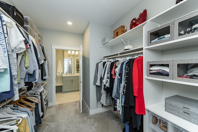 2720 Bentley Dr SW, Rochester, MN 55902 - spacious closet featuring a chandelier and carpet flooring