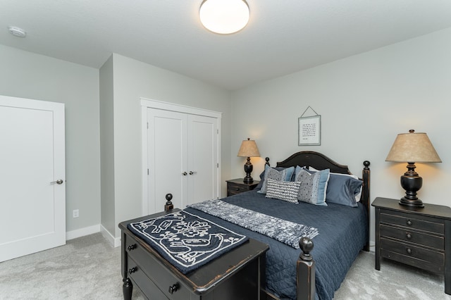2720 Bentley Dr SW, Rochester, MN 55902 - bedroom with light carpet, baseboards, and a closet