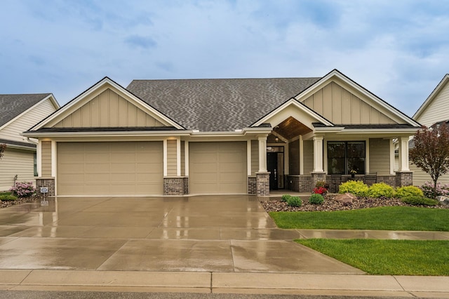 2720 Bentley Dr SW, Rochester, MN 55902 - craftsman-style home with board and batten siding, an attached garage, a porch, driveway, and a shingled roof