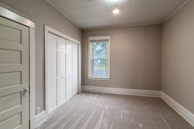 2320 3rd St N, Saint Cloud, MN 56303 - unfurnished bedroom featuring carpet flooring, a closet, and baseboards