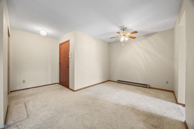 2802 29th Ave S, Moorhead, MN 56560 - carpeted empty room featuring baseboard heating, ceiling fan, baseboards, and a textured ceiling