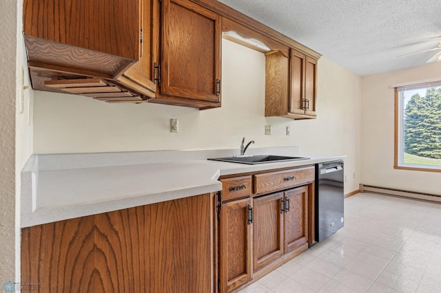 2802 29th Ave S, Moorhead, MN 56560 - kitchen with dishwasher, a sink, a baseboard heating unit, light countertops, and brown cabinetry