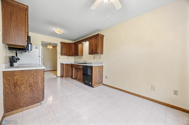 2802 29th Ave S, Moorhead, MN 56560 - kitchen featuring a ceiling fan, black dishwasher, a sink, baseboards, and light countertops