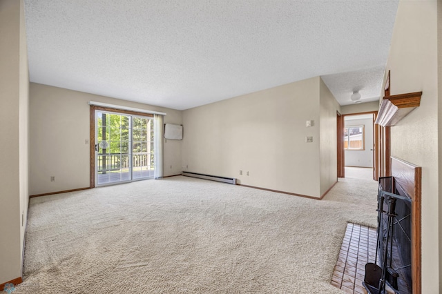2802 29th Ave S, Moorhead, MN 56560 - unfurnished living room with a textured ceiling, carpet floors, baseboard heating, and baseboards
