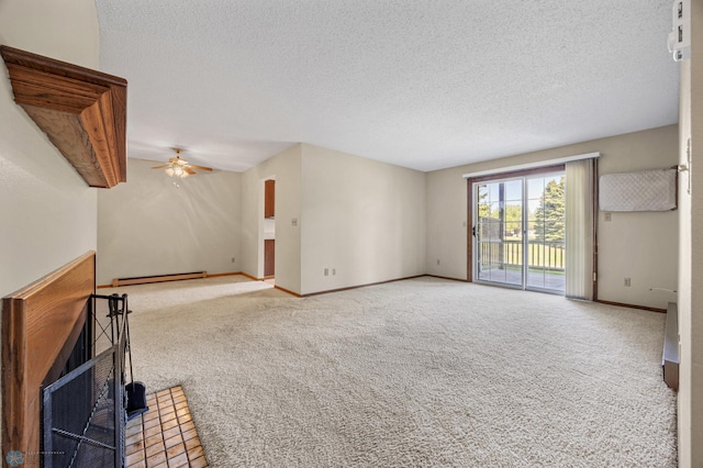 2802 29th Ave S, Moorhead, MN 56560 - unfurnished living room featuring a baseboard heating unit, carpet flooring, ceiling fan, baseboards, and a textured ceiling