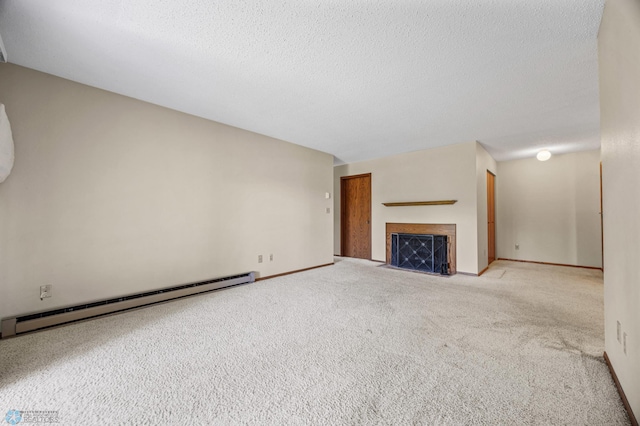 2802 29th Ave S, Moorhead, MN 56560 - unfurnished living room featuring a baseboard heating unit, carpet floors, a fireplace with flush hearth, a textured ceiling, and baseboards