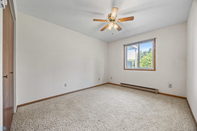 2802 29th Ave S, Moorhead, MN 56560 - carpeted spare room featuring a baseboard radiator, baseboards, ceiling fan, and a textured ceiling