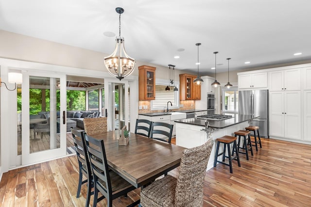 8580 Maple View Dr, Cologne, MN 55322 - dining room featuring light wood-type flooring, a chandelier, and recessed lighting