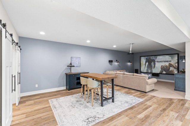 8580 Maple View Dr, Cologne, MN 55322 - office featuring a barn door, light wood-type flooring, baseboards, and recessed lighting