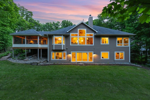 8580 Maple View Dr, Cologne, MN 55322 - back of property with a chimney, a lawn, a sunroom, and a shingled roof