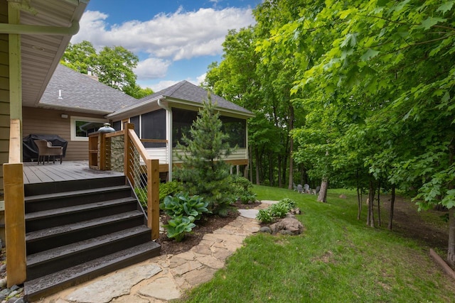 8580 Maple View Dr, Cologne, MN 55322 - entrance to property featuring a shingled roof, a deck, and a lawn