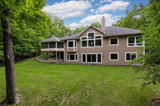 8580 Maple View Dr, Cologne, MN 55322 - rear view of property with a chimney, a sunroom, a lawn, and a shingled roof