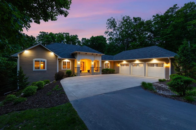8580 Maple View Dr, Cologne, MN 55322 - view of front facade with driveway, an attached garage, and board and batten siding