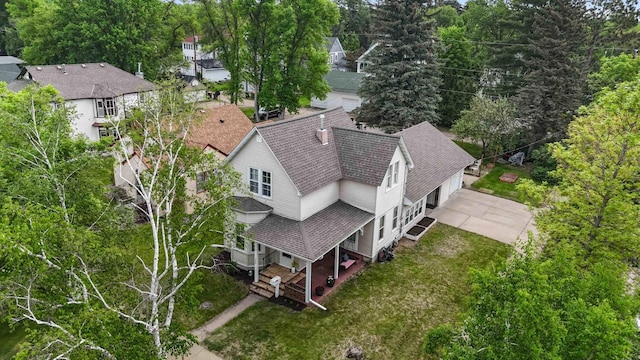 504 4th St, Brainerd, MN 56401 - aerial view of property and surrounding area featuring a tree filled landscape