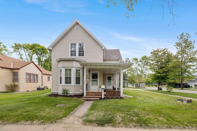 504 4th St, Brainerd, MN 56401 - view of front of home with a front yard, covered porch, and cooling unit