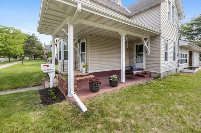 504 4th St, Brainerd, MN 56401 - view of property exterior with covered porch and a lawn