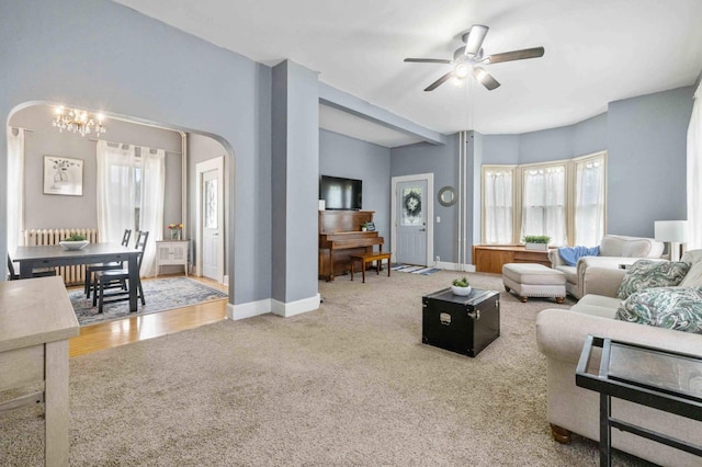 504 4th St, Brainerd, MN 56401 - living area featuring carpet flooring, arched walkways, ceiling fan, and baseboards
