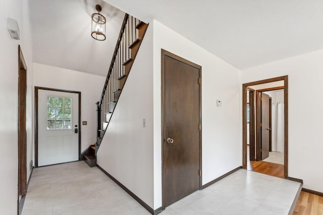 7674 Ideal Ave S, Cottage Grove, MN 55016 - entryway featuring stairway and baseboards