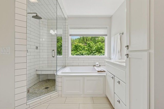 9375 Cold Stream Ln, Eden Prairie, MN 55347 - bathroom with a stall shower, a garden tub, tile patterned floors, and vanity