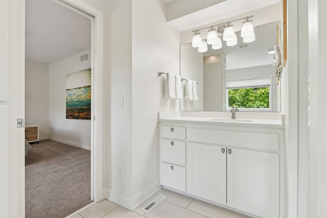 9375 Cold Stream Ln, Eden Prairie, MN 55347 - bathroom featuring baseboards, vanity, and tile patterned flooring