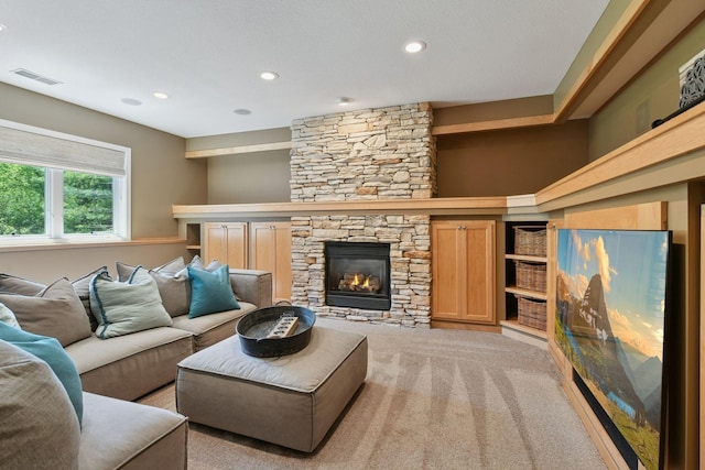 9375 Cold Stream Ln, Eden Prairie, MN 55347 - living area featuring a stone fireplace, recessed lighting, and light carpet
