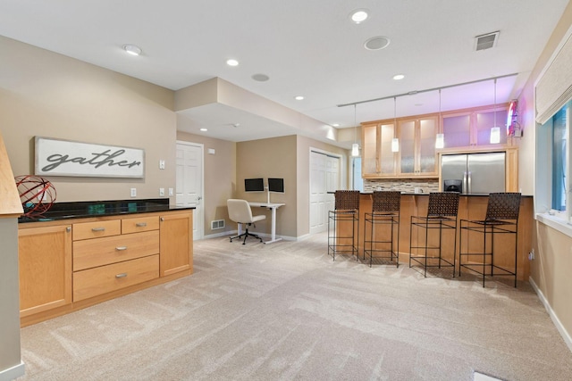 9375 Cold Stream Ln, Eden Prairie, MN 55347 - kitchen with stainless steel fridge with ice dispenser, light colored carpet, a kitchen breakfast bar, a peninsula, and recessed lighting