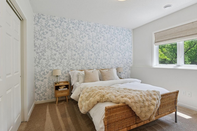 9375 Cold Stream Ln, Eden Prairie, MN 55347 - bedroom featuring wallpapered walls, carpet floors, and baseboards