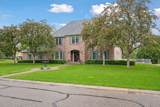 1511 Colleen Ave, Arden Hills, MN 55112 - colonial-style house with a front lawn and brick siding