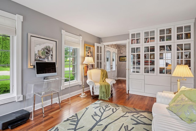 1511 Colleen Ave, Arden Hills, MN 55112 - living room with healthy amount of natural light, hardwood / wood-style flooring, and baseboards
