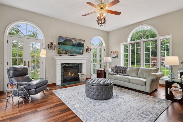 1511 Colleen Ave, Arden Hills, MN 55112 - living area with french doors, dark wood-type flooring, a ceiling fan, and a premium fireplace