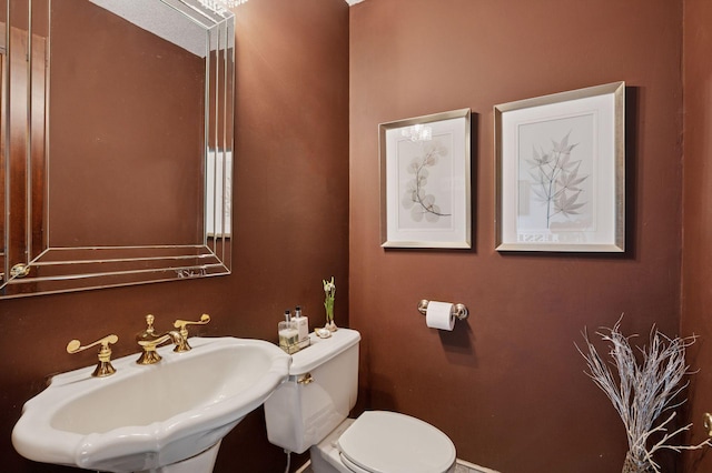 1511 Colleen Ave, Arden Hills, MN 55112 - bathroom with a sink, toilet, and baseboards