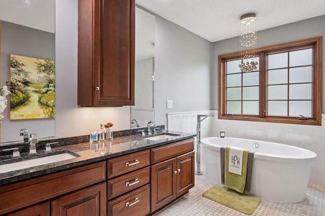 1511 Colleen Ave, Arden Hills, MN 55112 - full bath with a freestanding tub, double vanity, a chandelier, and tile walls