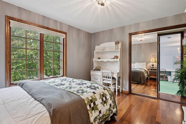 1511 Colleen Ave, Arden Hills, MN 55112 - bedroom with hardwood / wood-style flooring and a textured ceiling