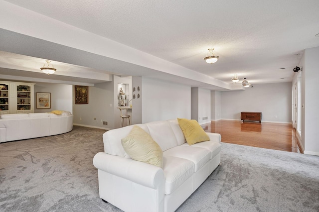 1511 Colleen Ave, Arden Hills, MN 55112 - carpeted living room with baseboards and a textured ceiling