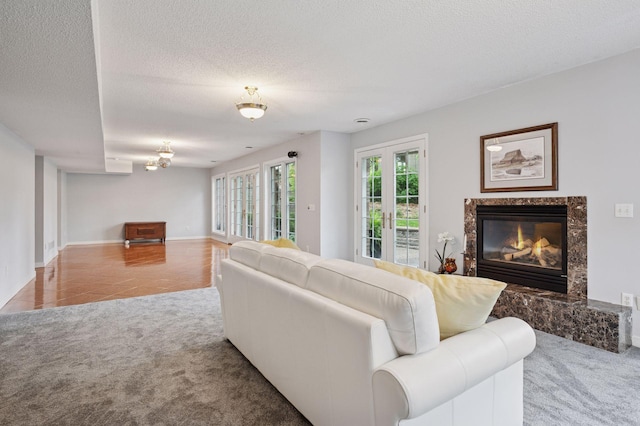 1511 Colleen Ave, Arden Hills, MN 55112 - living room featuring carpet floors, a high end fireplace, tile patterned flooring, a textured ceiling, and baseboards