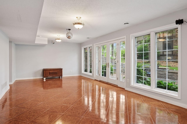 1511 Colleen Ave, Arden Hills, MN 55112 - empty room featuring baseboards, tile patterned floors, and a textured ceiling