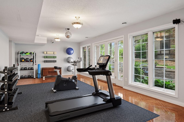 1511 Colleen Ave, Arden Hills, MN 55112 - exercise room with tile patterned flooring, a textured ceiling, and baseboards