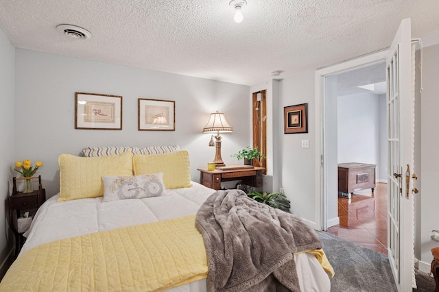 1511 Colleen Ave, Arden Hills, MN 55112 - bedroom with tile patterned floors and a textured ceiling