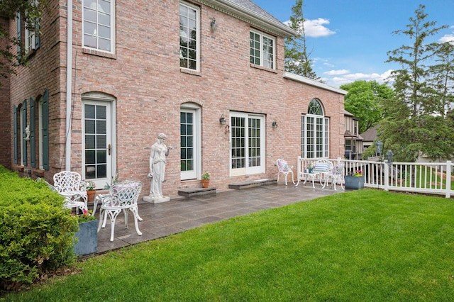 1511 Colleen Ave, Arden Hills, MN 55112 - back of property with a patio area and brick siding