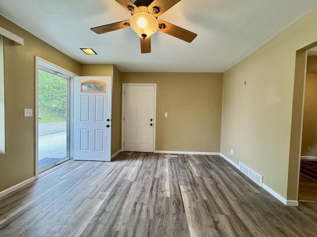 115 1st St SE, Pelican Rapids, MN 56572 - foyer with wood finished floors, baseboards, and a ceiling fan