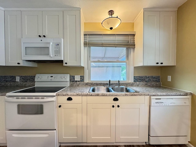 115 1st St SE, Pelican Rapids, MN 56572 - kitchen with white appliances, a sink, white cabinetry, and crown molding