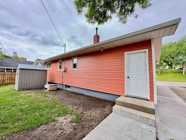 115 1st St SE, Pelican Rapids, MN 56572 - view of side of property with a chimney and entry steps