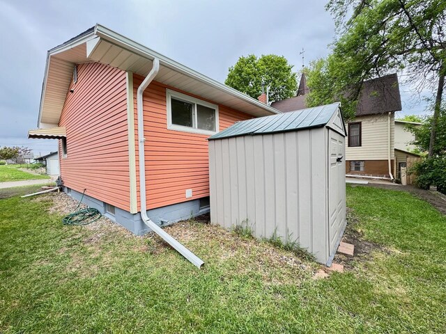 115 1st St SE, Pelican Rapids, MN 56572 - view of side of home featuring a lawn